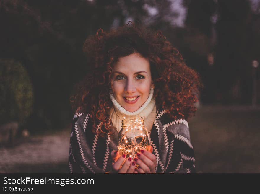 Woman Holding Glass Jar Lantern