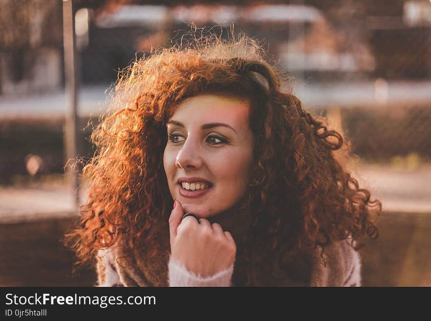 Woman Curly Hair With White Long-sleeved Top