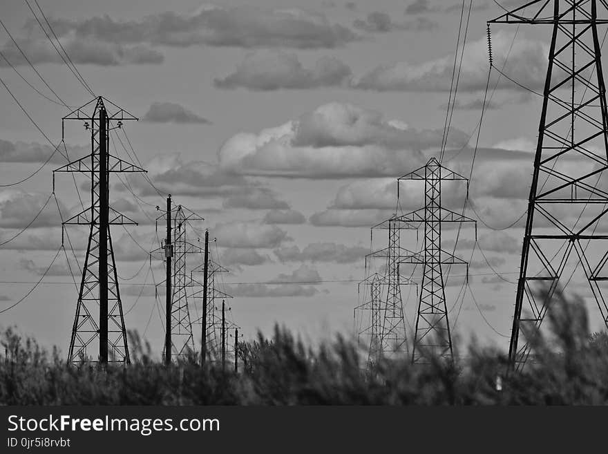 Grayscale Photo of Electricity Towers