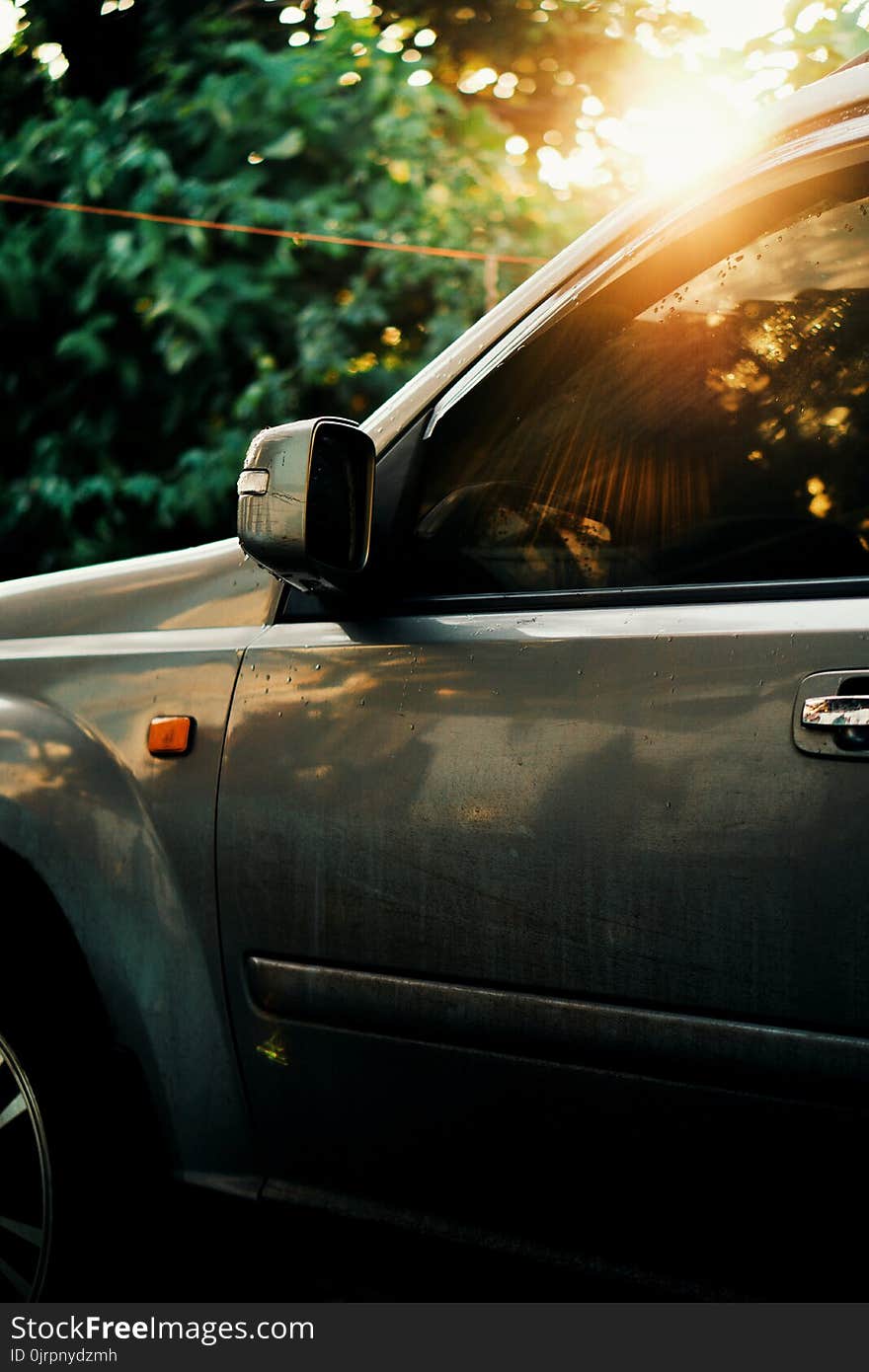 Selective Focus Photography of Green Vehicle