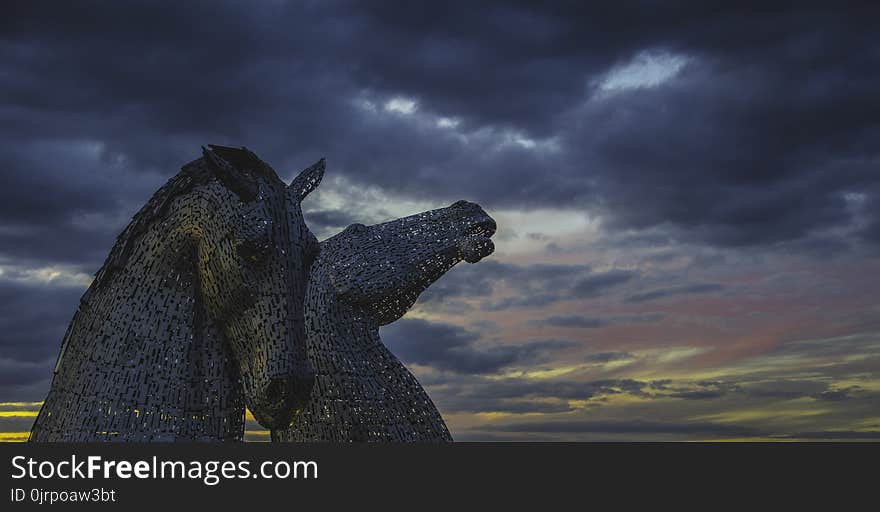 Two Grey Horse Statue Under Cloudy Sky