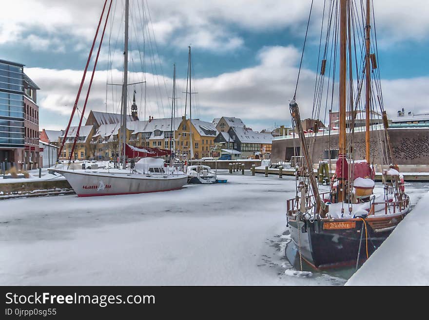 Sail Ships Near Concrete Boardwalk