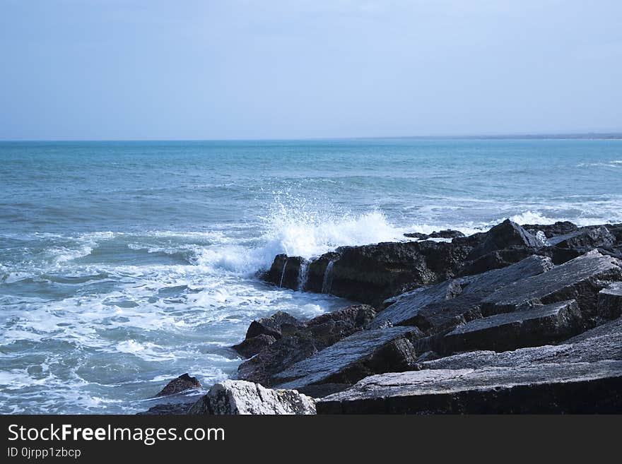 Black Rock Natural Formation Front of Sea