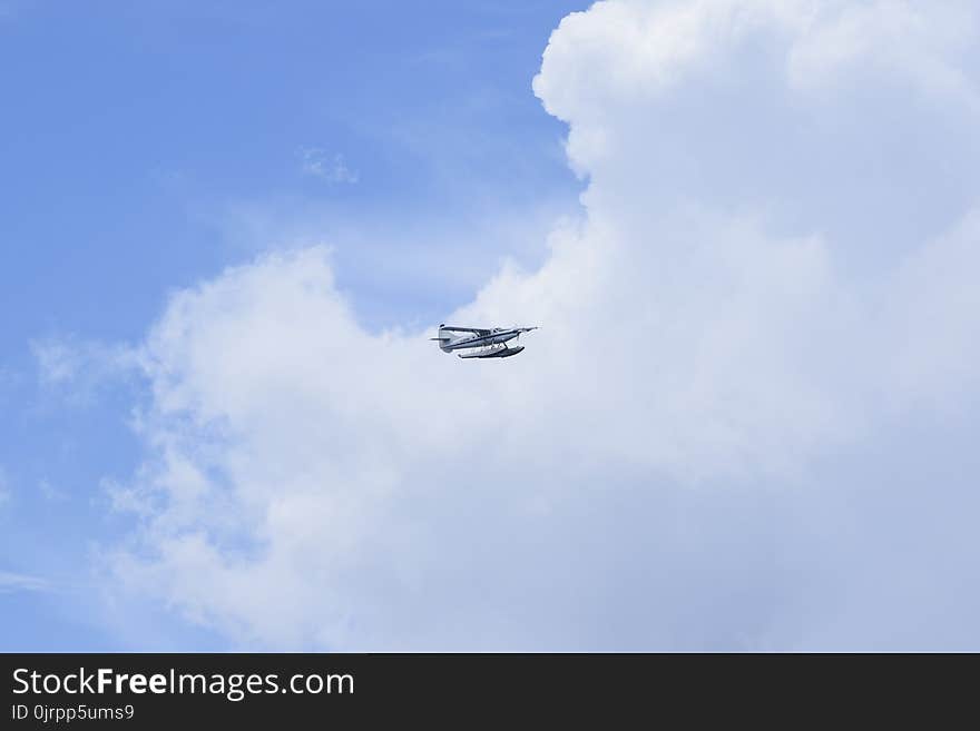 White Hydroplane Flying on the Sky