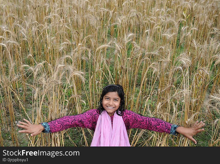 Woman Taking Selfie in Brown Grass Field