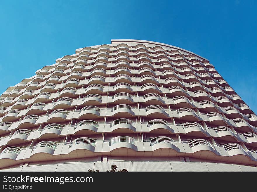 Low-angle Photography of Grey Concrete Multi-storey Building