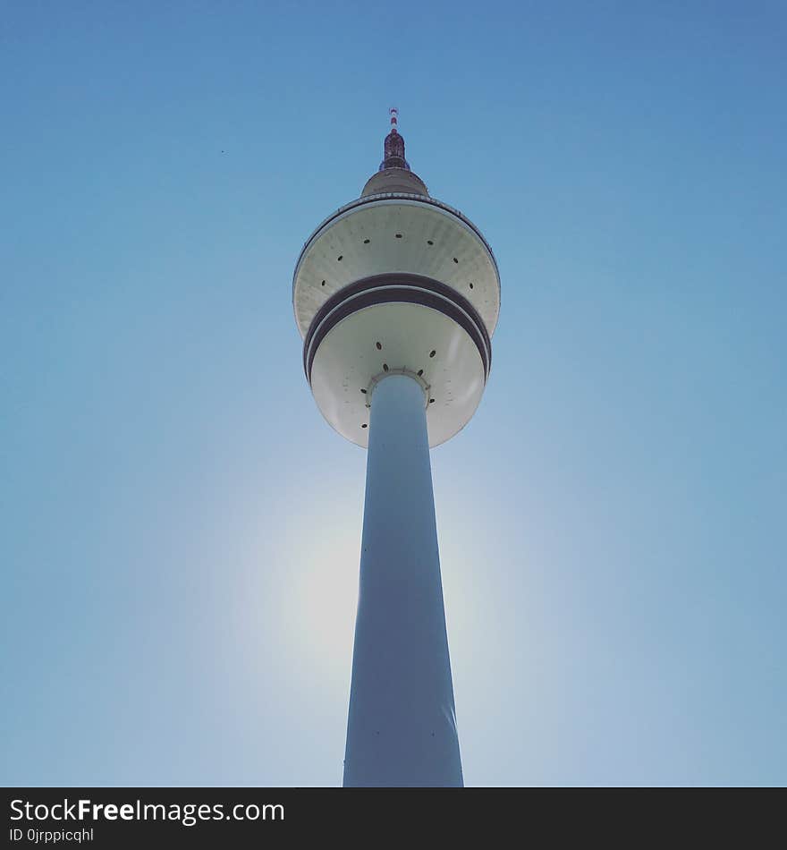 Low-angle Photography of White and Beige Concrete Tower