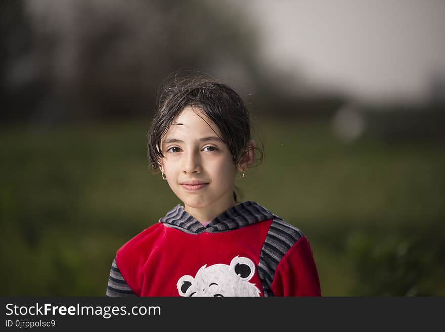 Girl Wearing Red and Black Hoodie