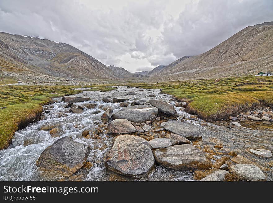 Photo of River Filled With Bolder Rocks