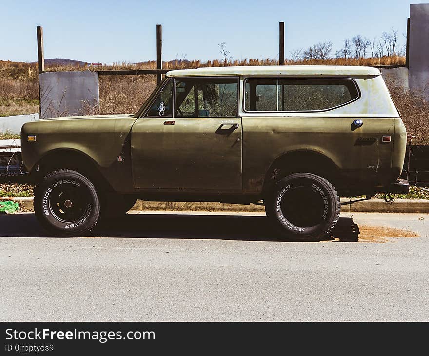 Classic Beige and White Sports Utility Vehicle on Road