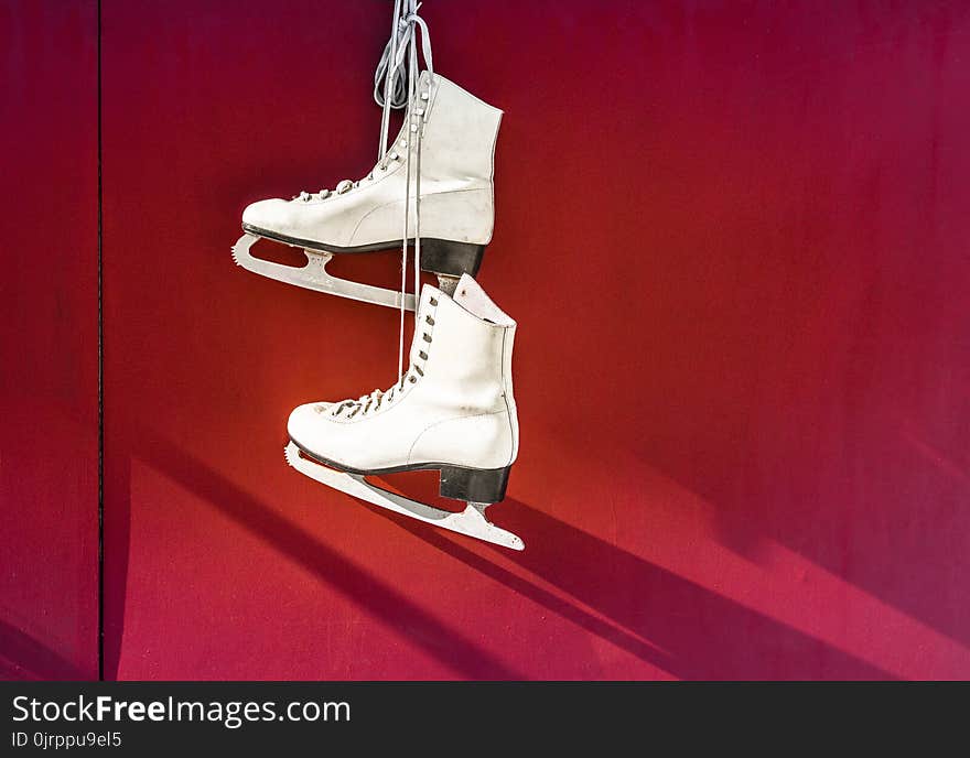 Hanged Pair of White Leather Figure Skates