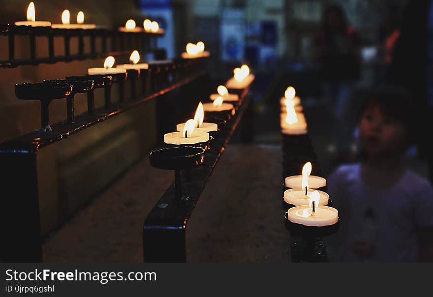 White Tealight Candles Lit during Nighttime