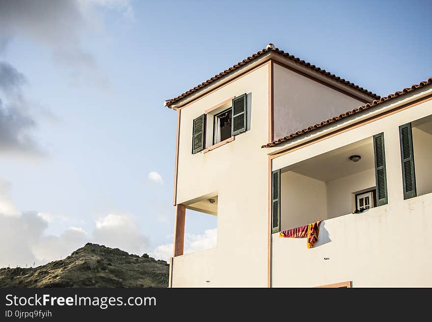 White Concrete House Under Blue Sky