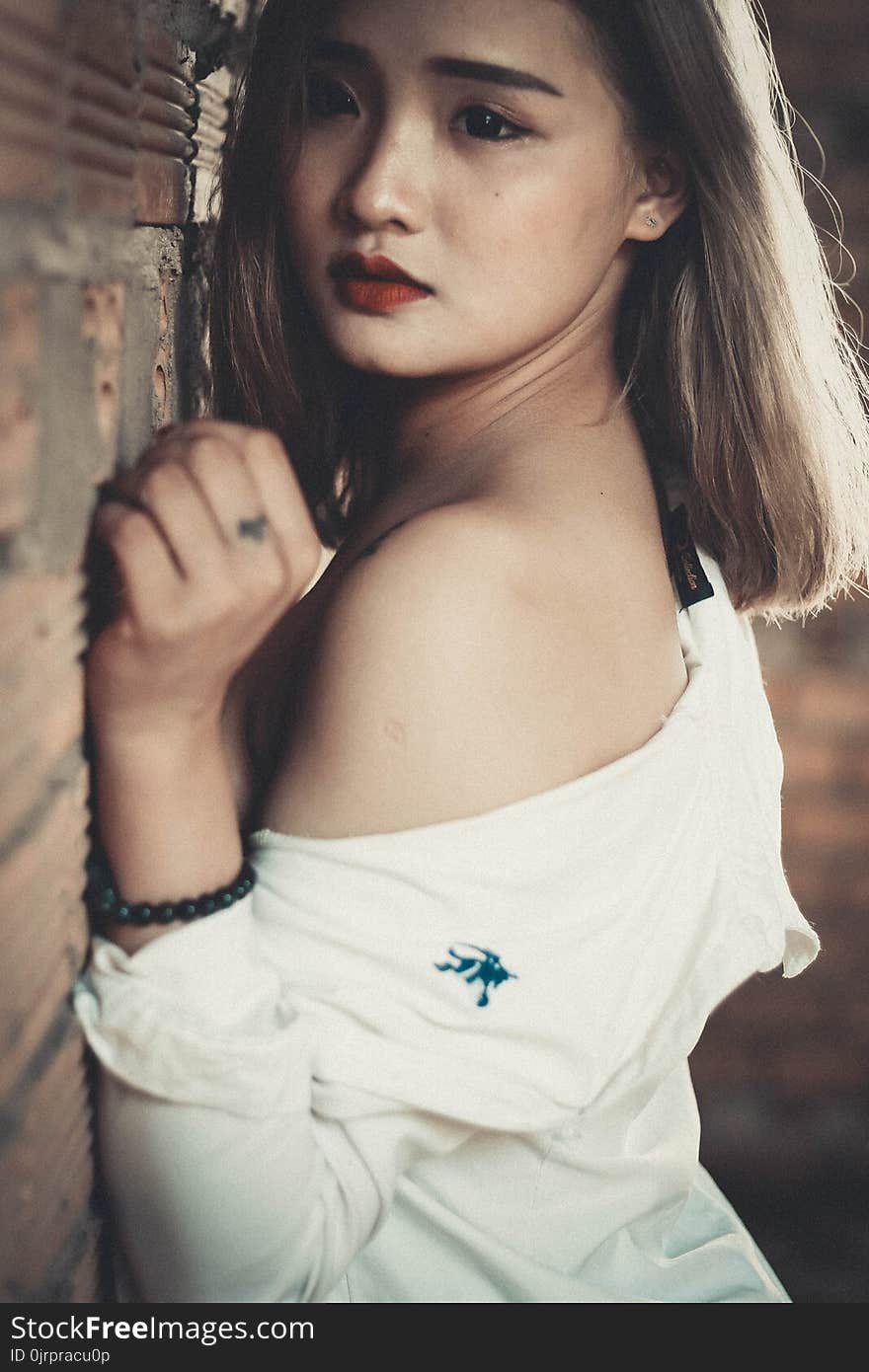 Shallow Focus Photography of Woman in White Off-shoulder Top