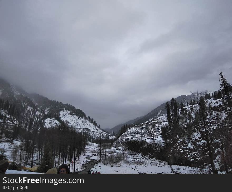 Grayscale Photograph of Mountain Covered With Snow