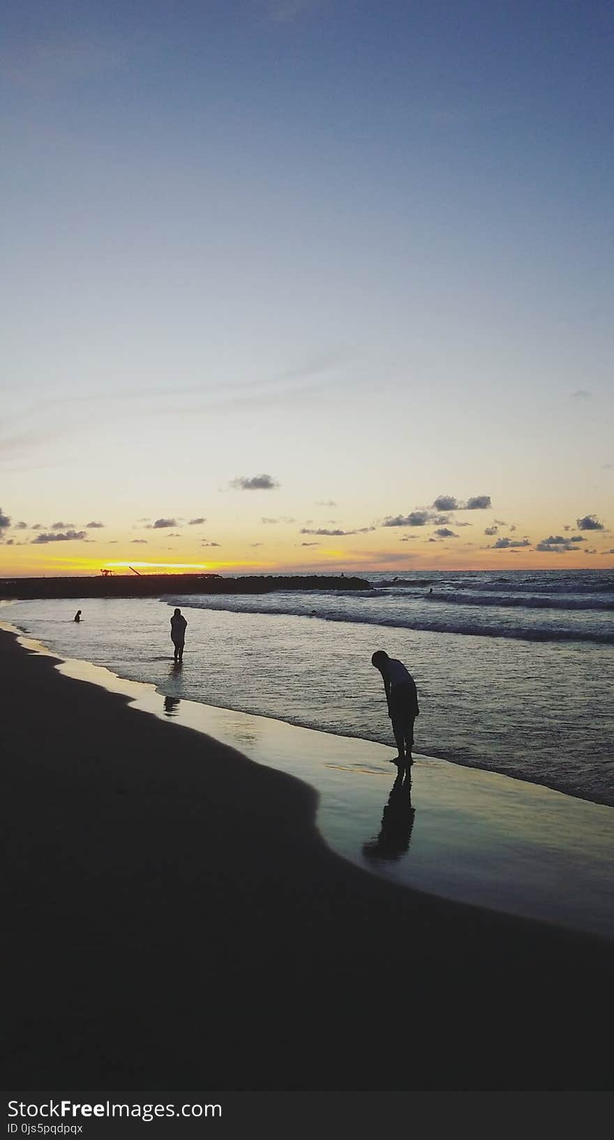 Two People at Beach during Sunrise