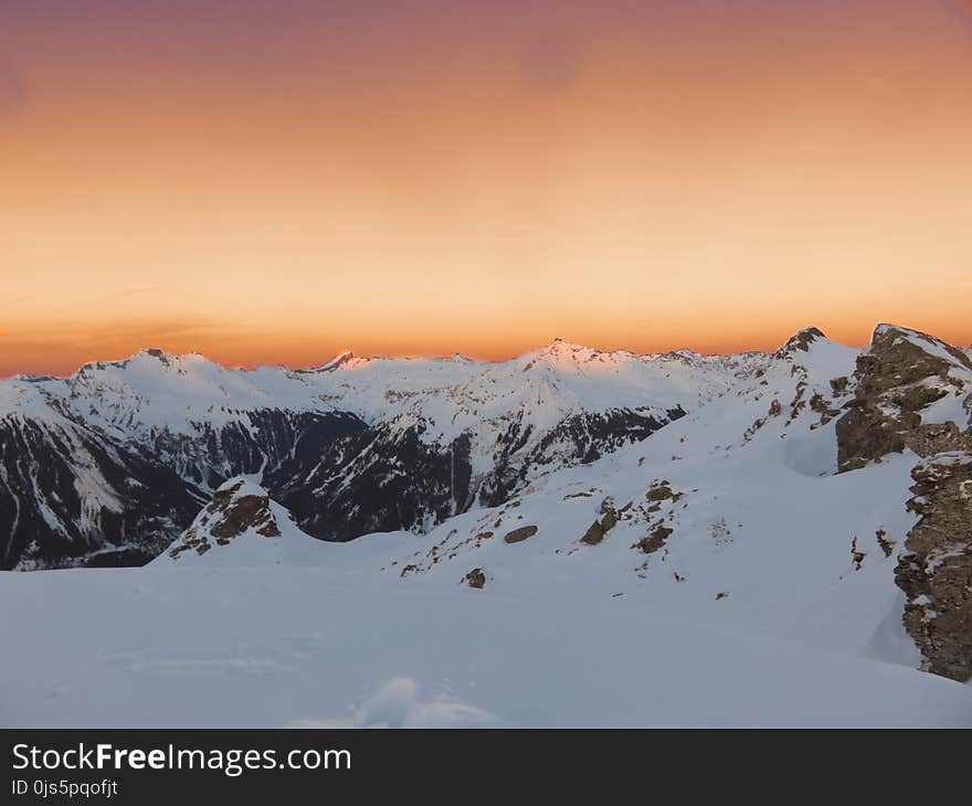 Mountain Covered With Snow during Sunset