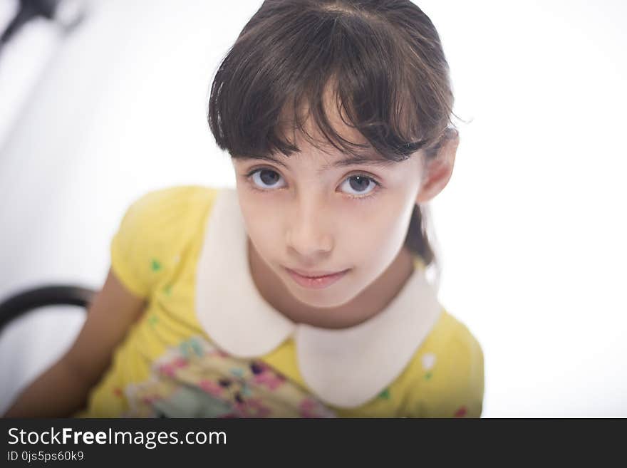 Girl in Yellow and White Collared Short-sleeved Top