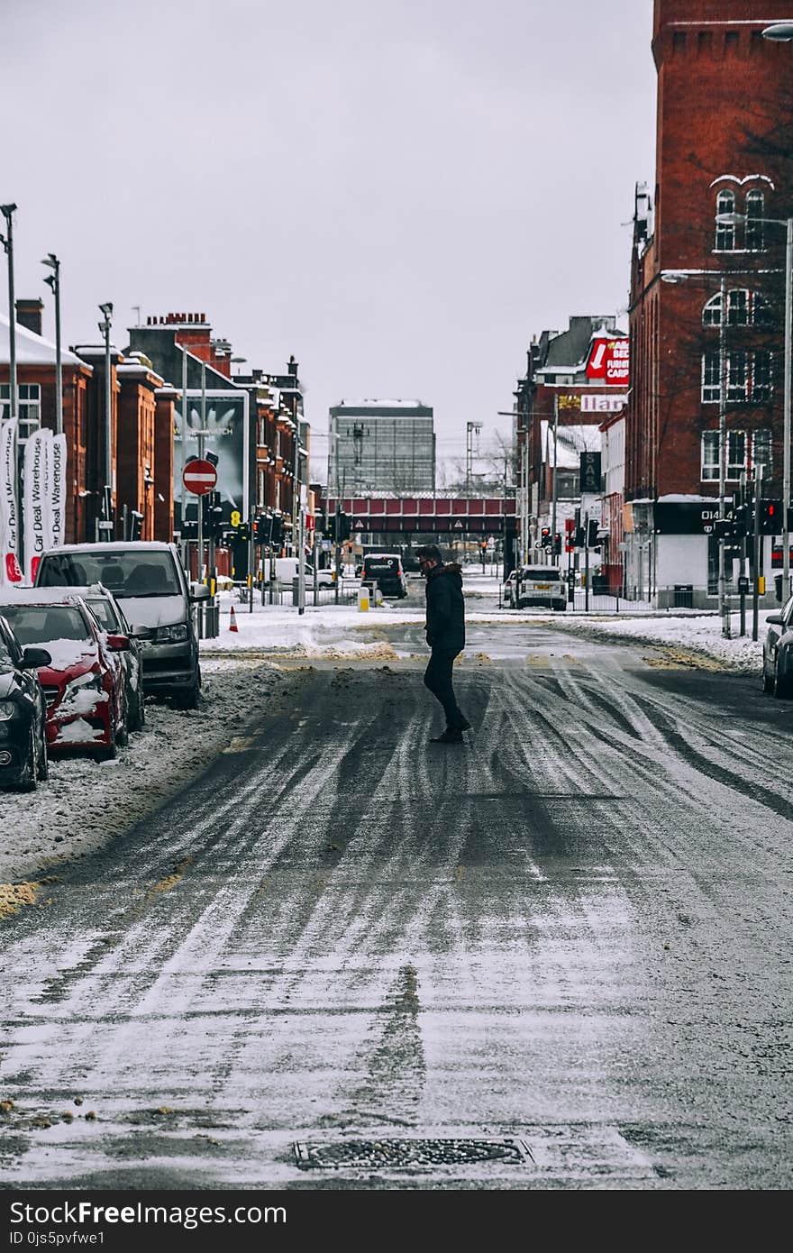 Man Standing in the Middle of the Road