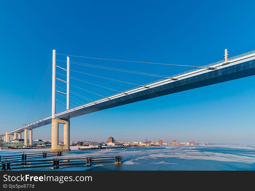 White Metal Bridge Under the Blue Sky