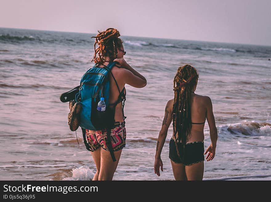 Two Woman Wearing Bikini Beside Seashore