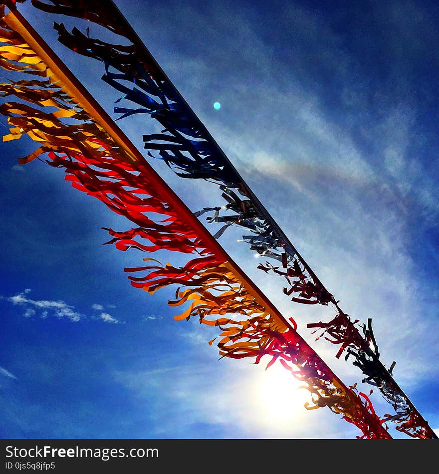 Banners Under Blue Sky