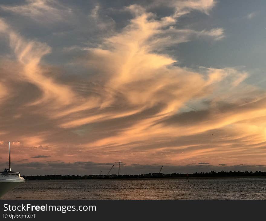 Photography White Boat on Body of Water during Sunset