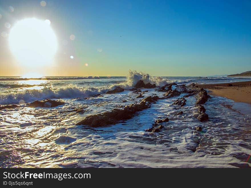 Portrait Photography of Seashore and Sun