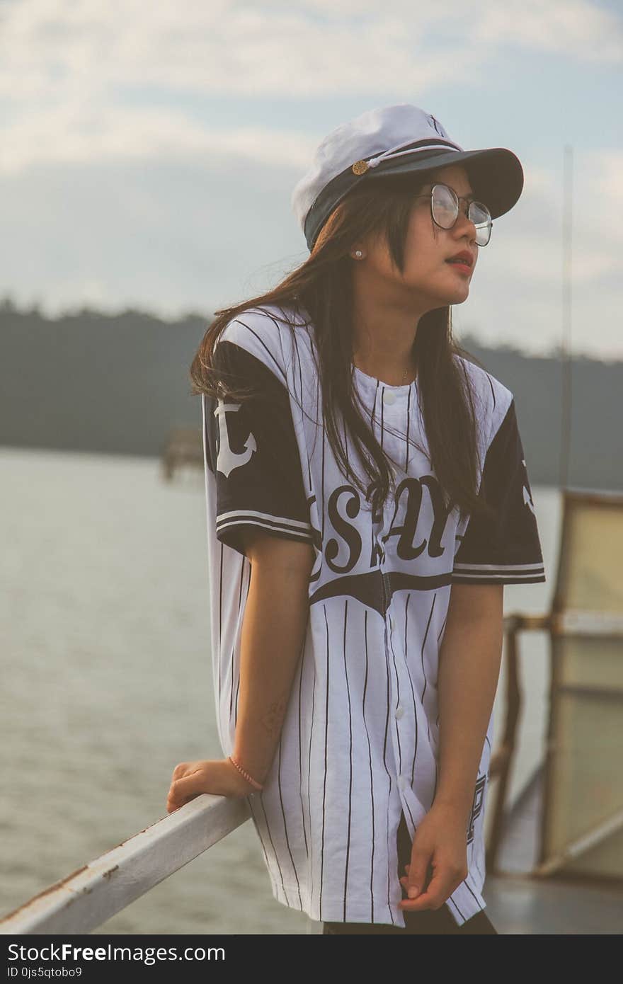 Woman Wearing White-and-black Cap and Crew-neck T-shirt