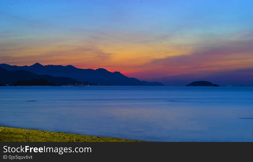 Photo of Ocean Apart from Mountain