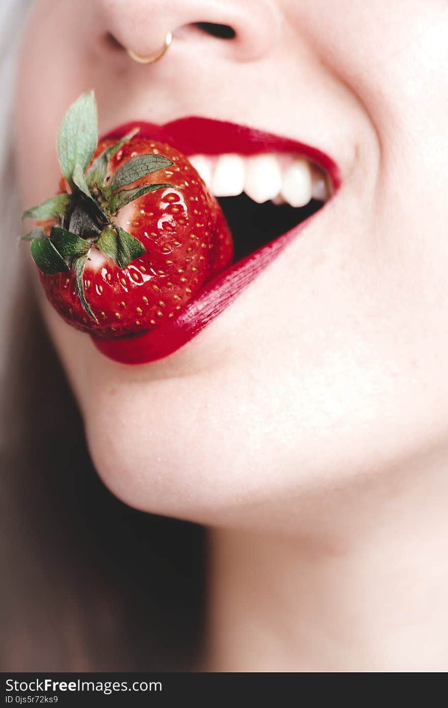 Woman Biting Strawberry