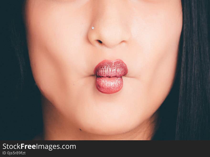 Woman Wearing Red Lipgloss