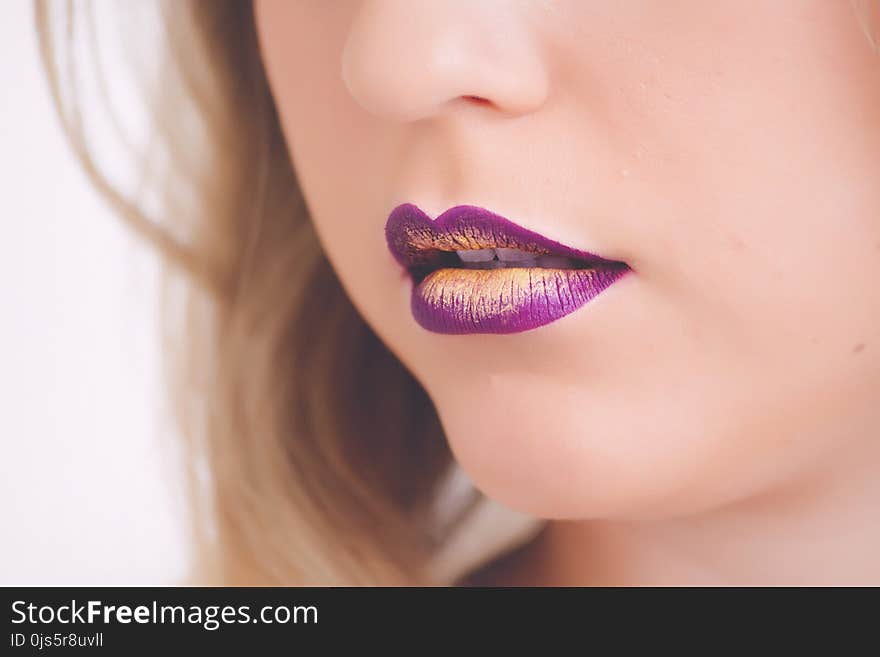 Woman Wearing Purple and Beige Lipstick