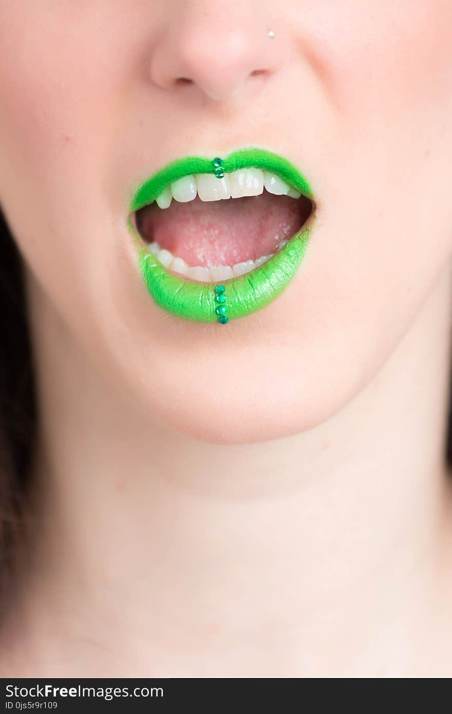 Woman Wearing Green Lipstick With an Open Mouth