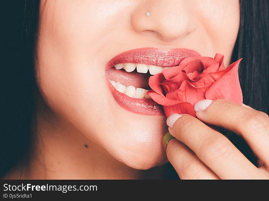 Woman Biting the Red Rose