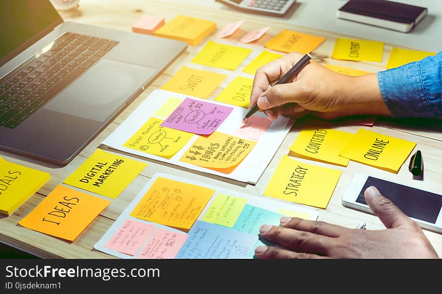 Businessman working with notepaper of strategy ideas.Business communication, brainstorming,meeting,plan concepts