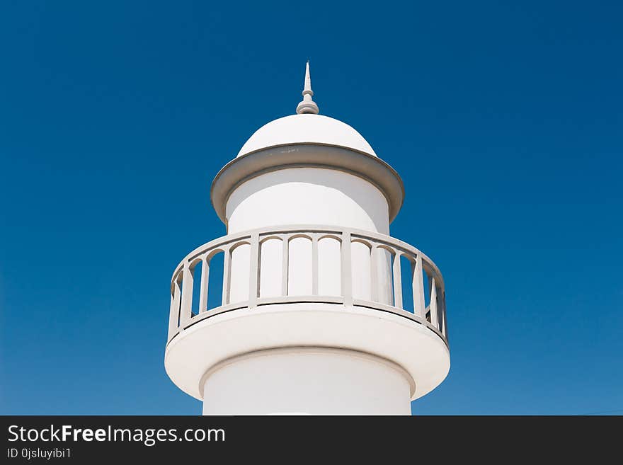 White Lighthouse Under Blue Sky