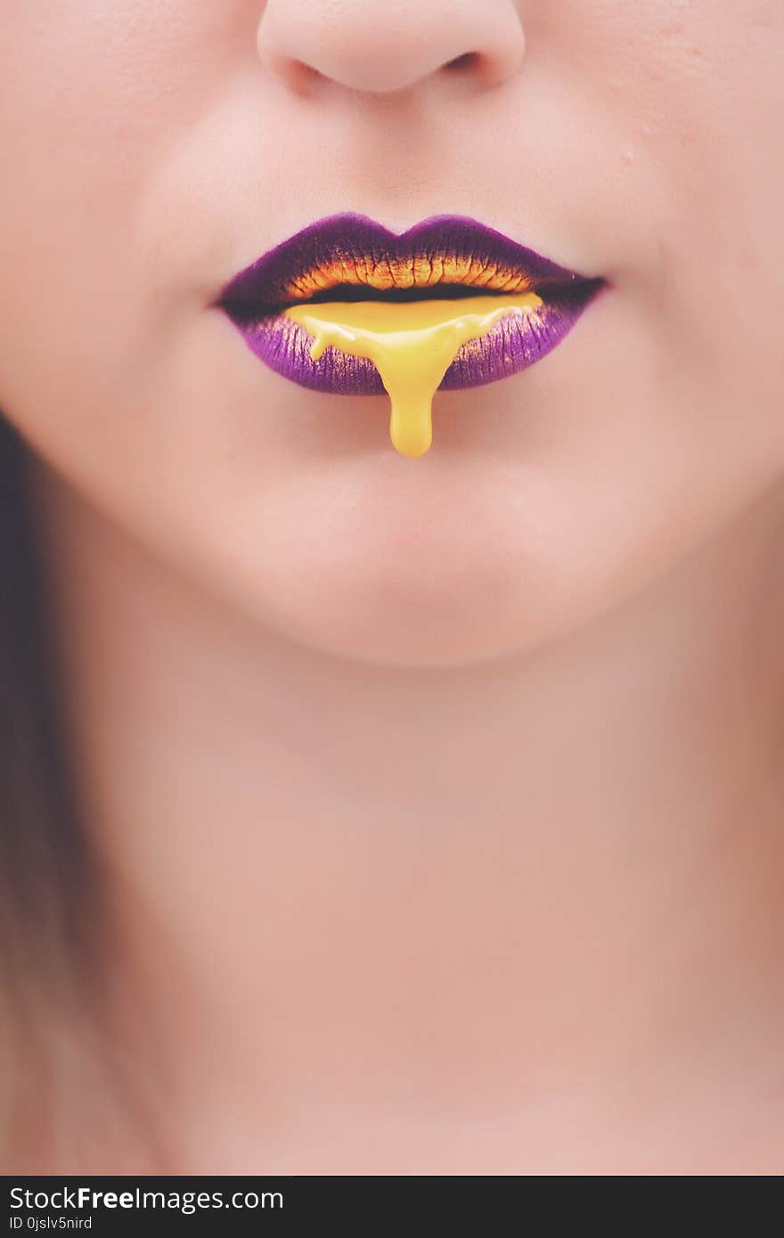 Yellow Liquid on Woman&#x27;s Lips