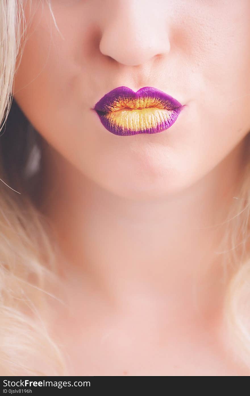 Woman Wearing Purple and Yellow Lipstick