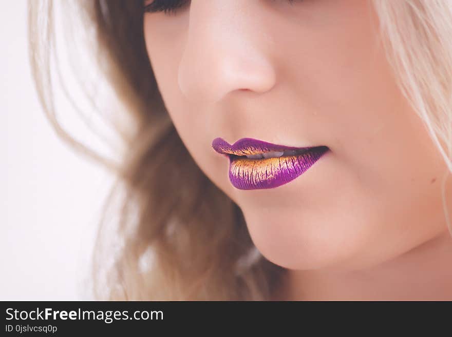 Woman Wearing Pink and Yellow Lipstick