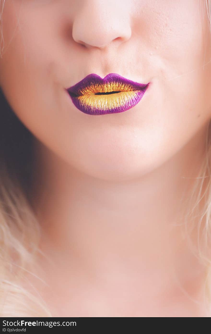 Woman With Purple and Yellow Lipstick