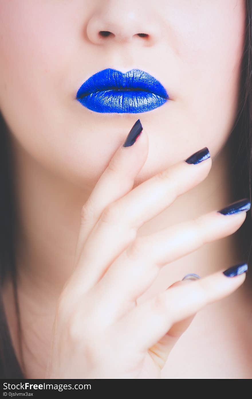 Woman Wearing Blue Lipstick and Manicure