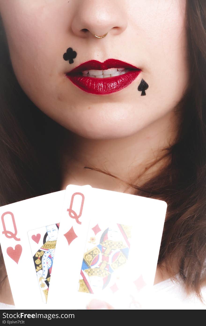 Woman Holding Queen of Hearts and Diamonds