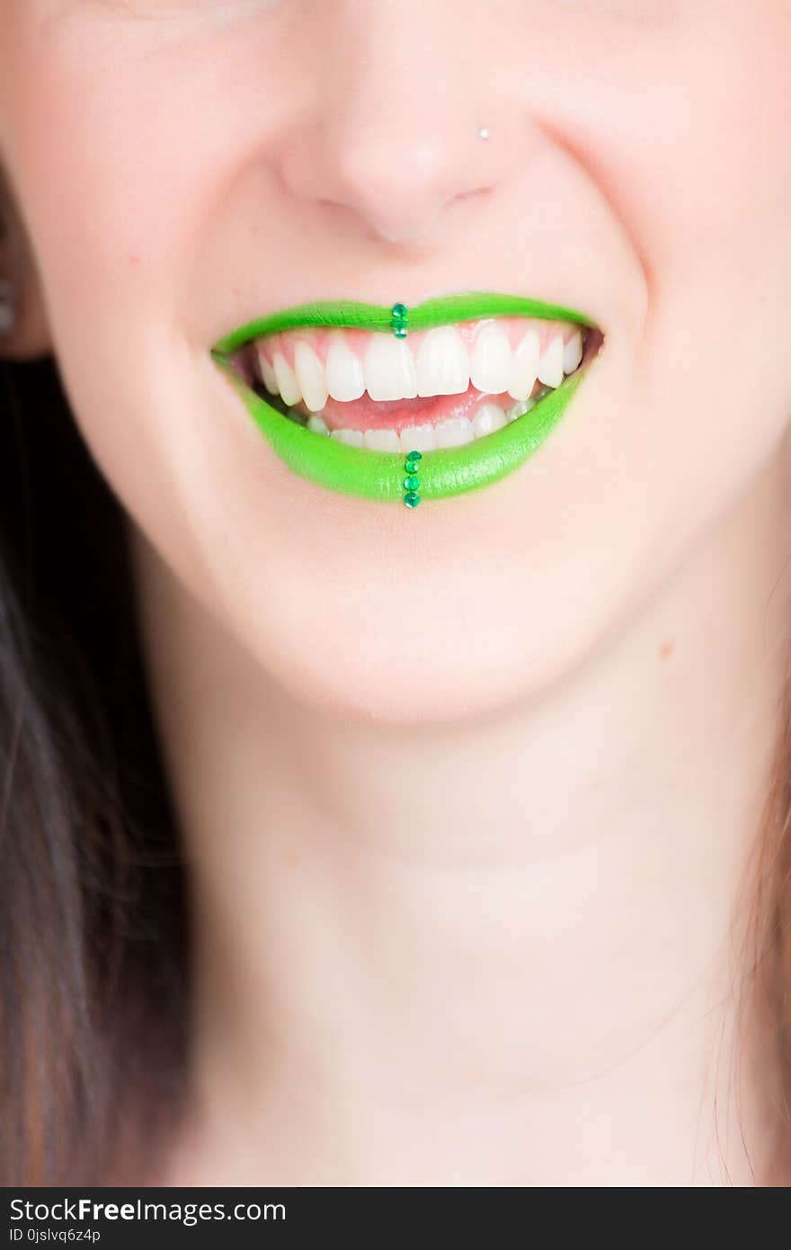 Woman Smiling With Green Lipstick