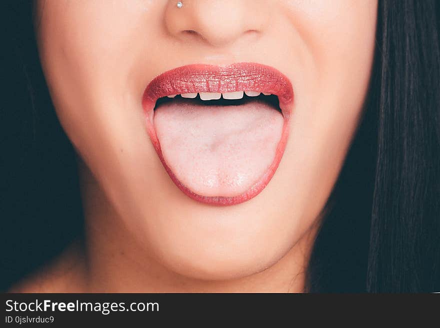 Woman With Wide Open Mouth and Tongue Out