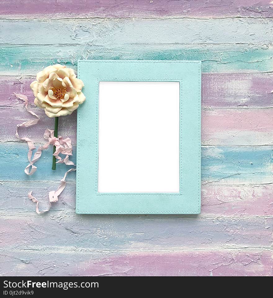 White frame on a wooden background