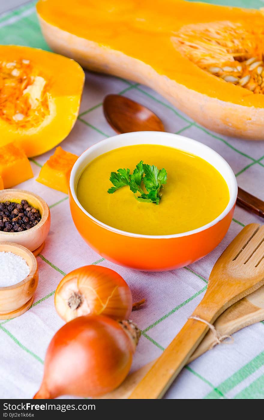 The Pumpkin Soup Served On The Table In Bowl