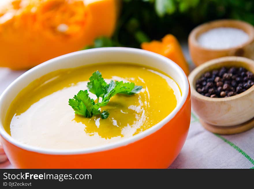 The Pumpkin Soup Served On The Table In Bowl