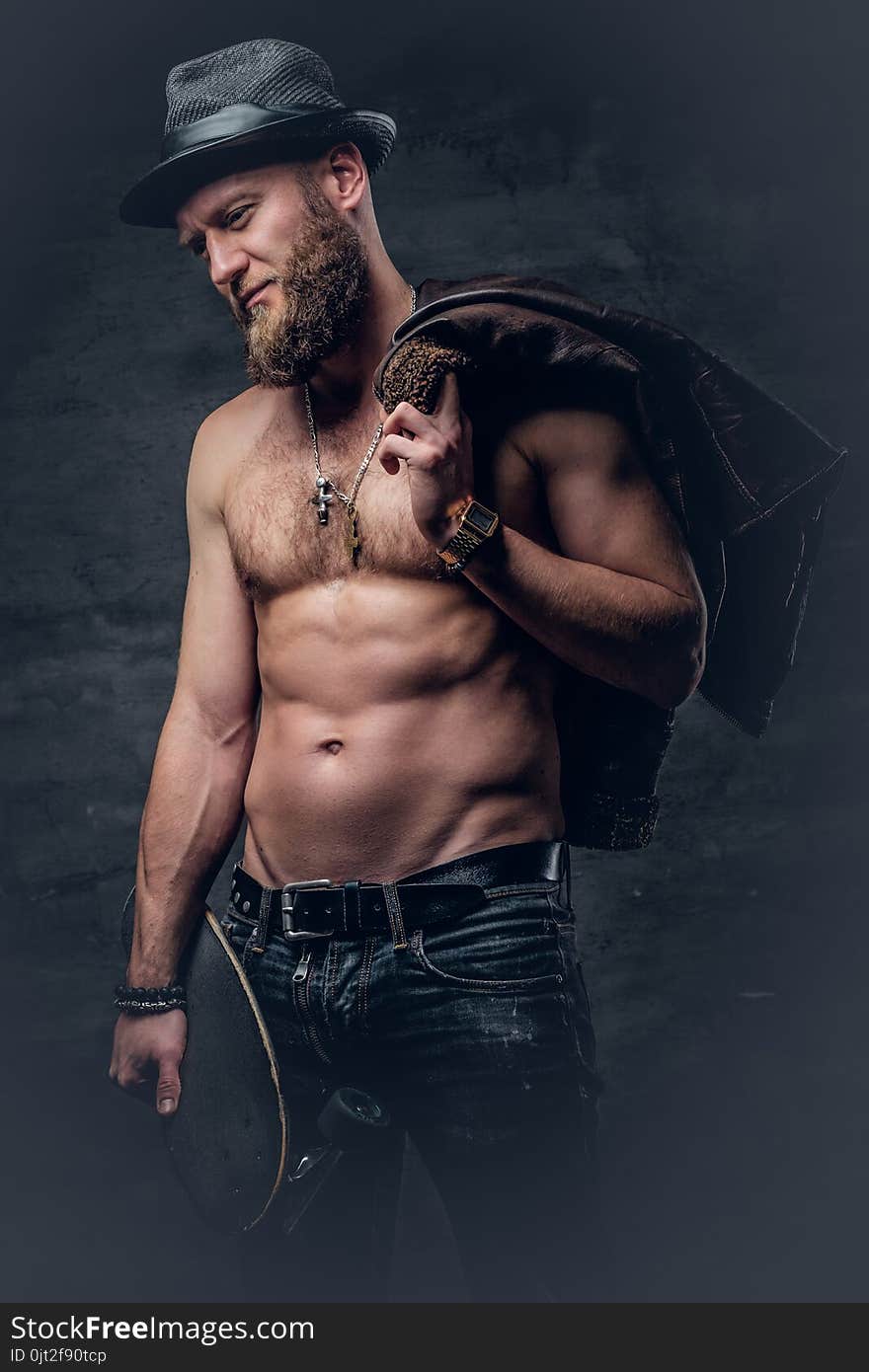 Shirtless Bearded Male Holds Skateboard.