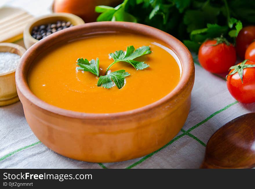 The Pumpkin Soup Served On The Table In Bowl